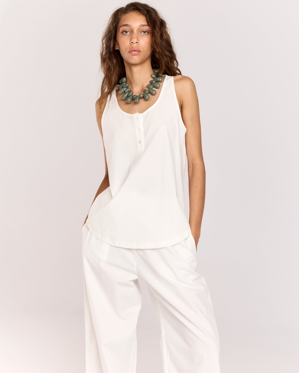 Introducing the Summer Tank, featuring an elegant scoop neckline adorned with self-covered buttons. Cut in an off-the-body, relaxed silhouette, this tank is crafted from beautifully soft cotton-tencel fabric that moves effortlessly with you, making it a perfect addition to your warm-weather wardrobe.