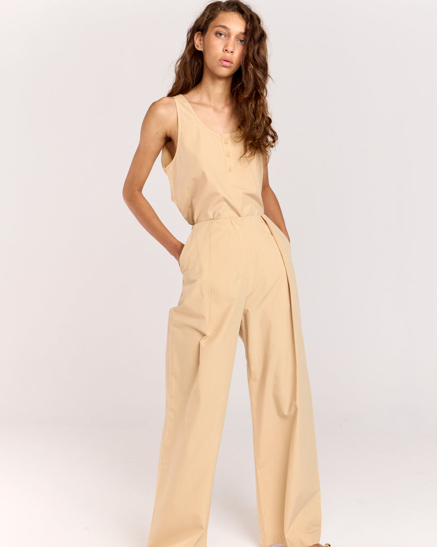 Elevate your wardrobe with the Summer Pant, a classic piece with a modern edge. Fitted at the waist and hips, it transitions into a relaxed straight-leg silhouette that elongates your figure. Crafted from soft, lightweight cotton-tencel, it features side pockets, a concealed zip, and back welt pockets for added functionality.