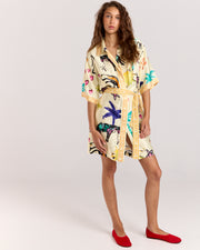 Elevate your style with the Lover Robe, a relaxed shirt-style mini dress featuring Jake Pedro's exclusive Lover Print. Crafted from matte viscose rayon twill, it includes a button front and a removable Romy belt tie for versatile styling.