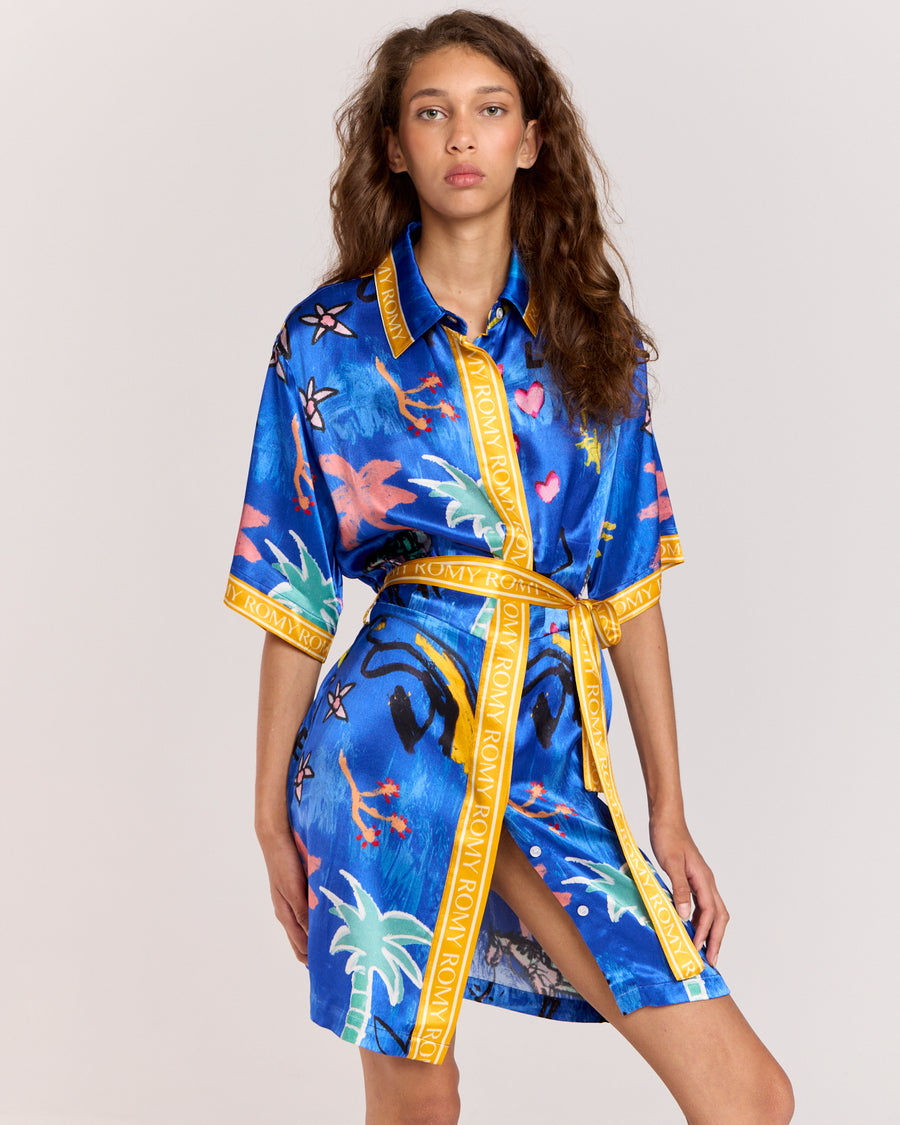 Discover the Lover Robe, a relaxed shirt-style mini dress exclusive to Romy, featuring Jake Pedro's Lover Print. Crafted from matte viscose rayon twill, it includes a button front and a removable Romy belt tie for versatile, effortless style.