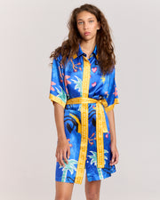 Discover the Lover Robe, a relaxed shirt-style mini dress exclusive to Romy, featuring Jake Pedro's Lover Print. Crafted from matte viscose rayon twill, it includes a button front and a removable Romy belt tie for versatile, effortless style.