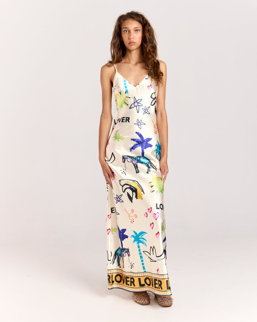 Elevate your style with the Lover Slip Dress, showcasing Jake Pedro's exclusive Lover Print. Crafted from luxurious satin with a high sheen, it features a flattering V-neckline, adjustable straps, and a graceful floor-length hem.