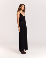 Step into elegance with this black maxi dress featuring contrast floral lace detail through the front to accentuate the waist. Crafted from matte satin, the relaxed silhouette falls gracefully with a side split and lace trim, finished with adjustable straps for a perfect fit.