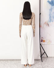 The Tailored Pant are an easy-wearing and versatile cream pant in a relaxed straight leg silhouette. Crafted with a soft wool blend, these pants are fully-lined, featuring a mid-waist rise, a hidden clasp closure, and an elasticated back for ease and comfort. These versatile white tailored pants are the perfect addition to your wardrobe.