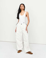 The Romy Cargo Pant in white is a relaxed trouser silhouette, crafted from a premium cotton blend fabrication. Designed for easy wear, it features a wide leg shape, an adjustable drawstring cord through the waist and finished with a toggle fastening. Show now.